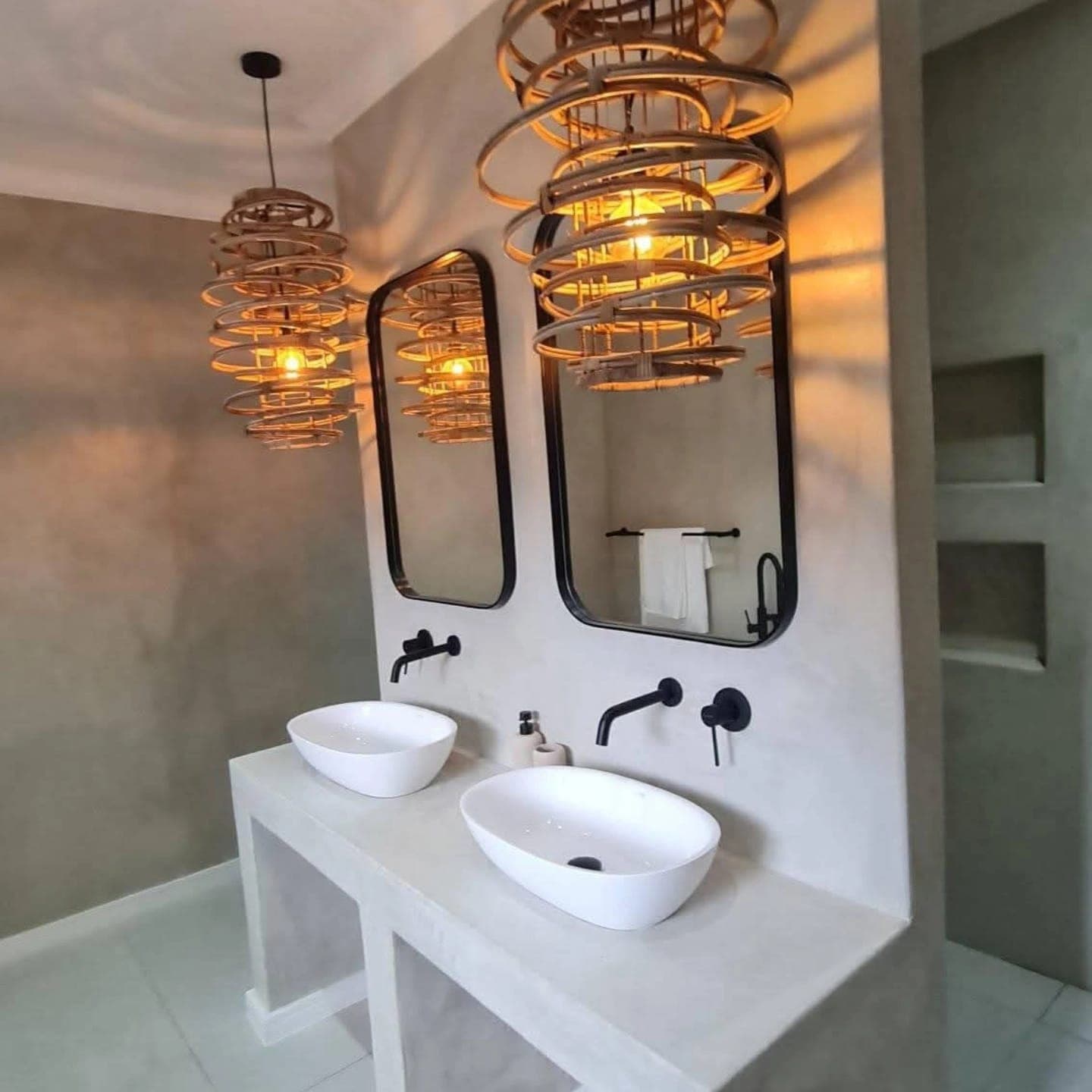 Designer bathroom with seamless microcement walls, vanity and floor by Junior Flooring